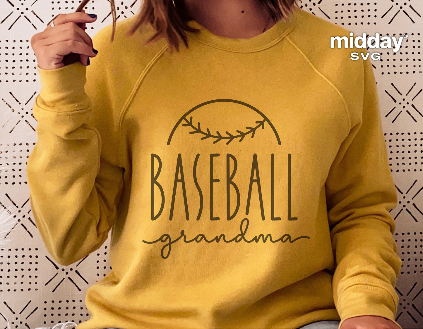 Yellow sweatshirt featuring a 'Baseball Grandma' design in brown text, ideal for Cricut and Silhouette projects.