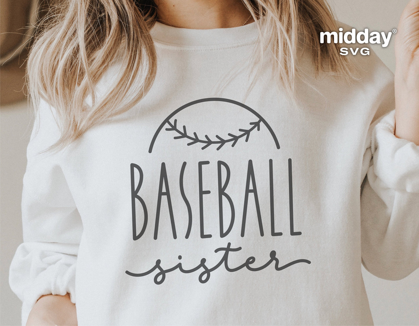 Woman wearing a Baseball Sister sweatshirt with stylish baseball design, perfect for Cricut and Silhouette crafting projects.