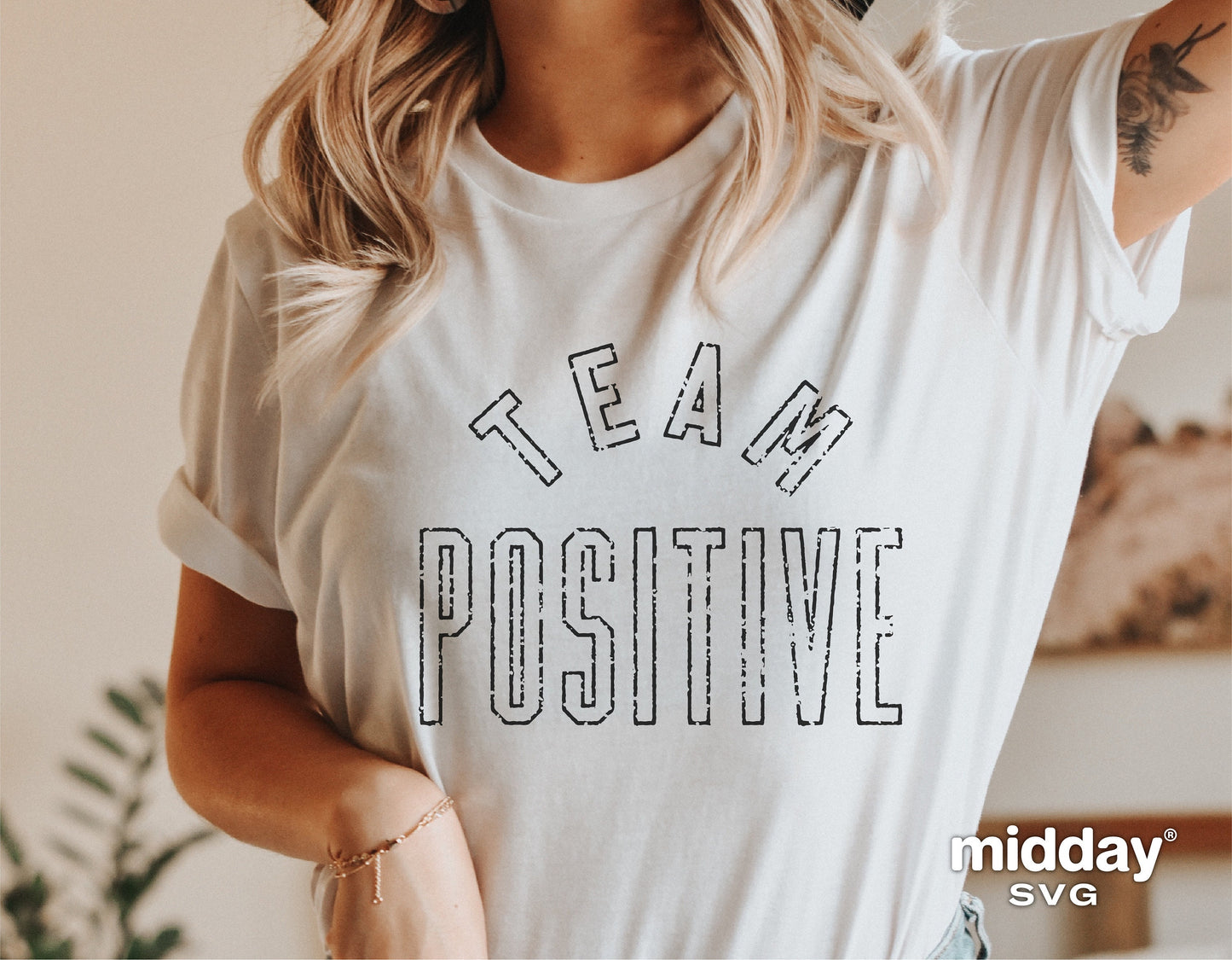 Woman wearing 'Team Positive' inspirational shirt, ideal for Cricut cutting projects; includes SVG, PNG, and DXF formats for designs.