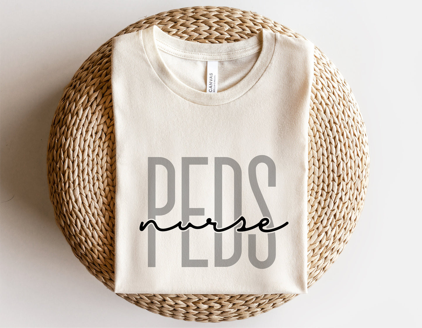 Pediatric nurse shirt reading 'PEDS nurse' on woven mat, ideal for Cricut and Silhouette projects in SVG, PNG format