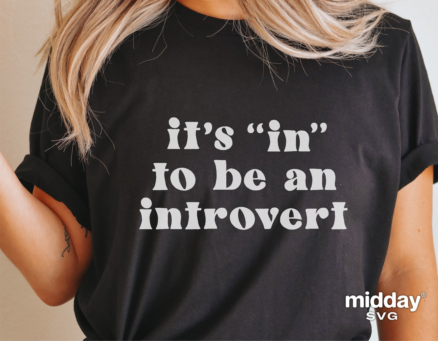 Black T-shirt with white text 'It's "in" to be an introvert' design, perfect for Cricut and Silhouette cutting projects.