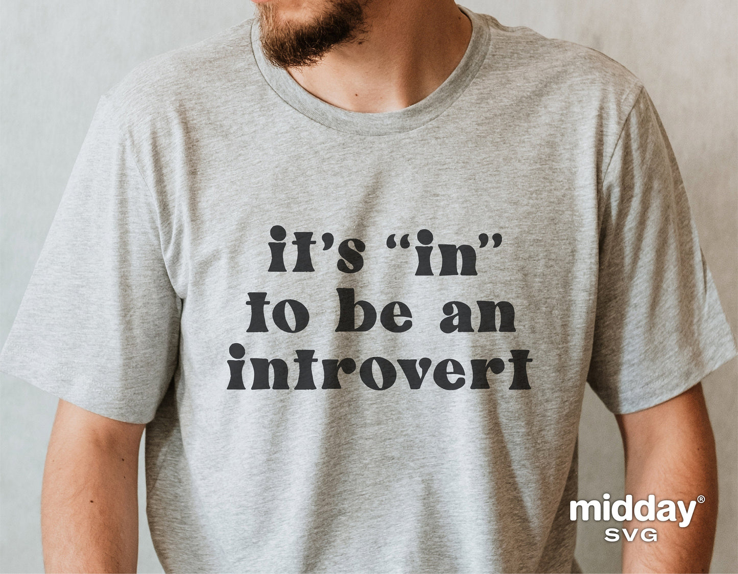 Gray t-shirt with 'It's "in" to be an introvert' text, showcasing funny sarcastic design from Midday SVG.