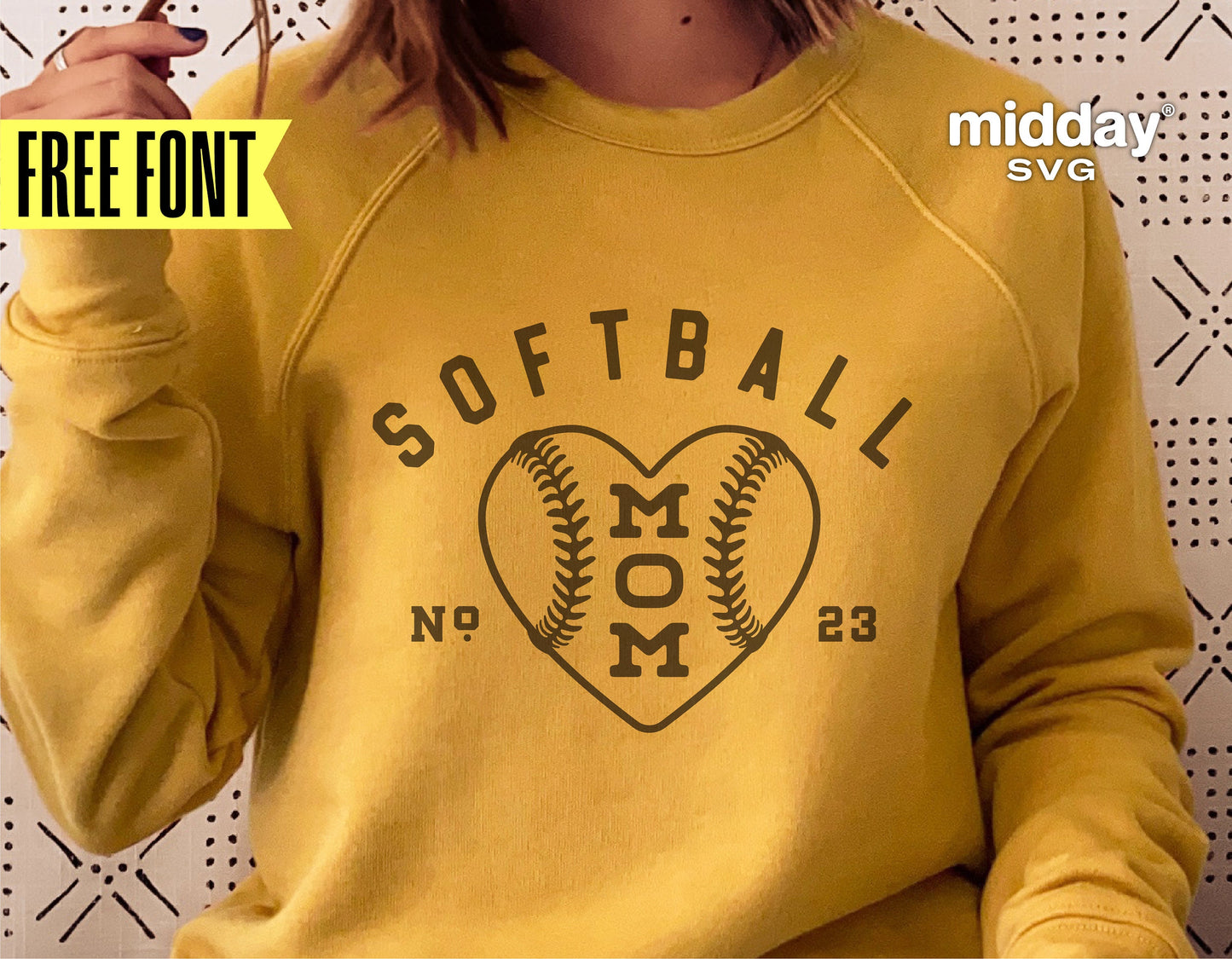 Yellow sweatshirt featuring 'Softball Mom' heart design in black, perfect for Cricut and Silhouette projects, with free font offer.