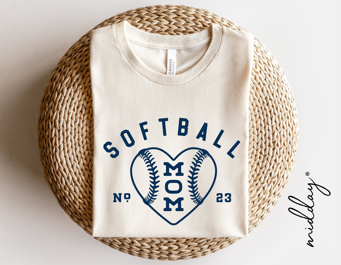 Softball Mom shirt with heart design featuring a softball motif, perfect for sports moms. Ideal for Cricut and Silhouette projects.