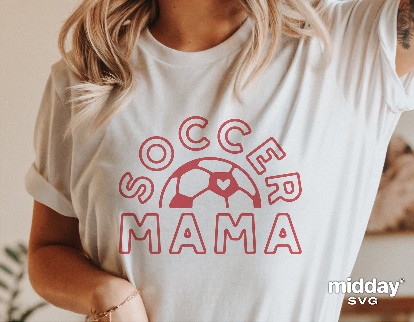 Woman wearing a 'Soccer Mama' shirt with a red soccer ball design, ideal for soccer moms, Cricut and Silhouette projects.