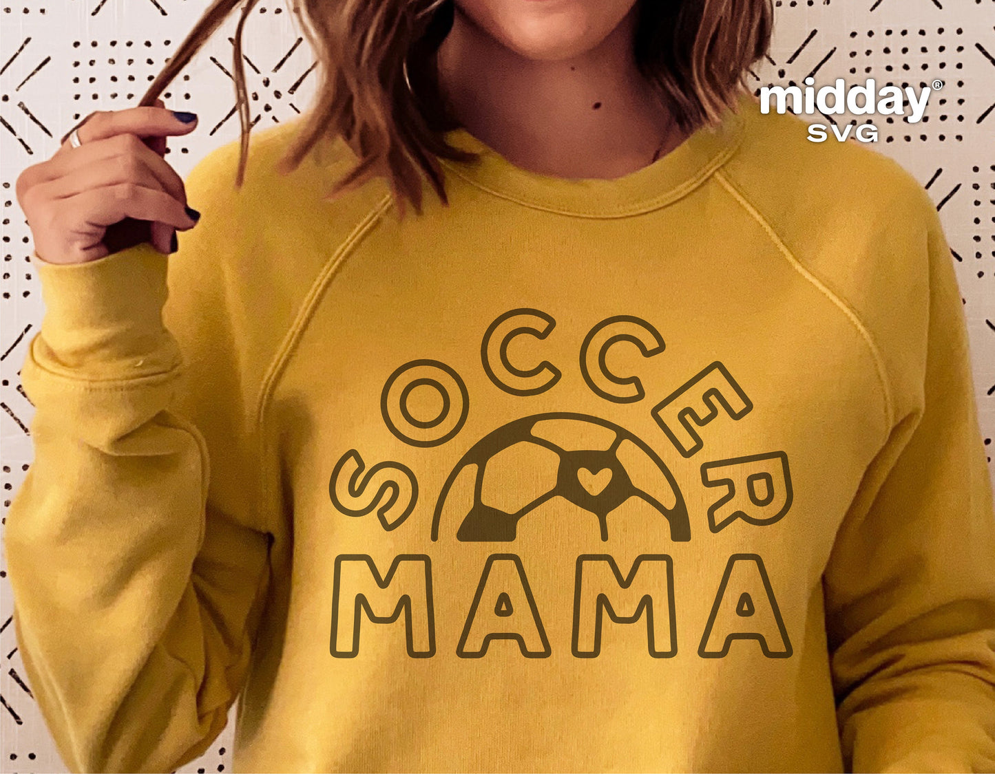 Yellow sweatshirt featuring "Soccer Mama" design with a soccer ball and a heart. Perfect for soccer mom enthusiasts. Available as SVG.