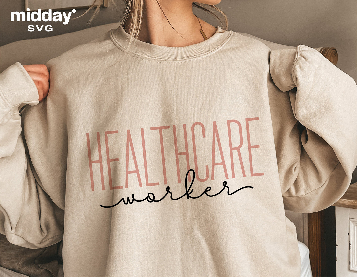 Healthcare worker wearing beige shirt with 'Healthcare Worker' text design in pink and black for Cricut and Silhouette projects.