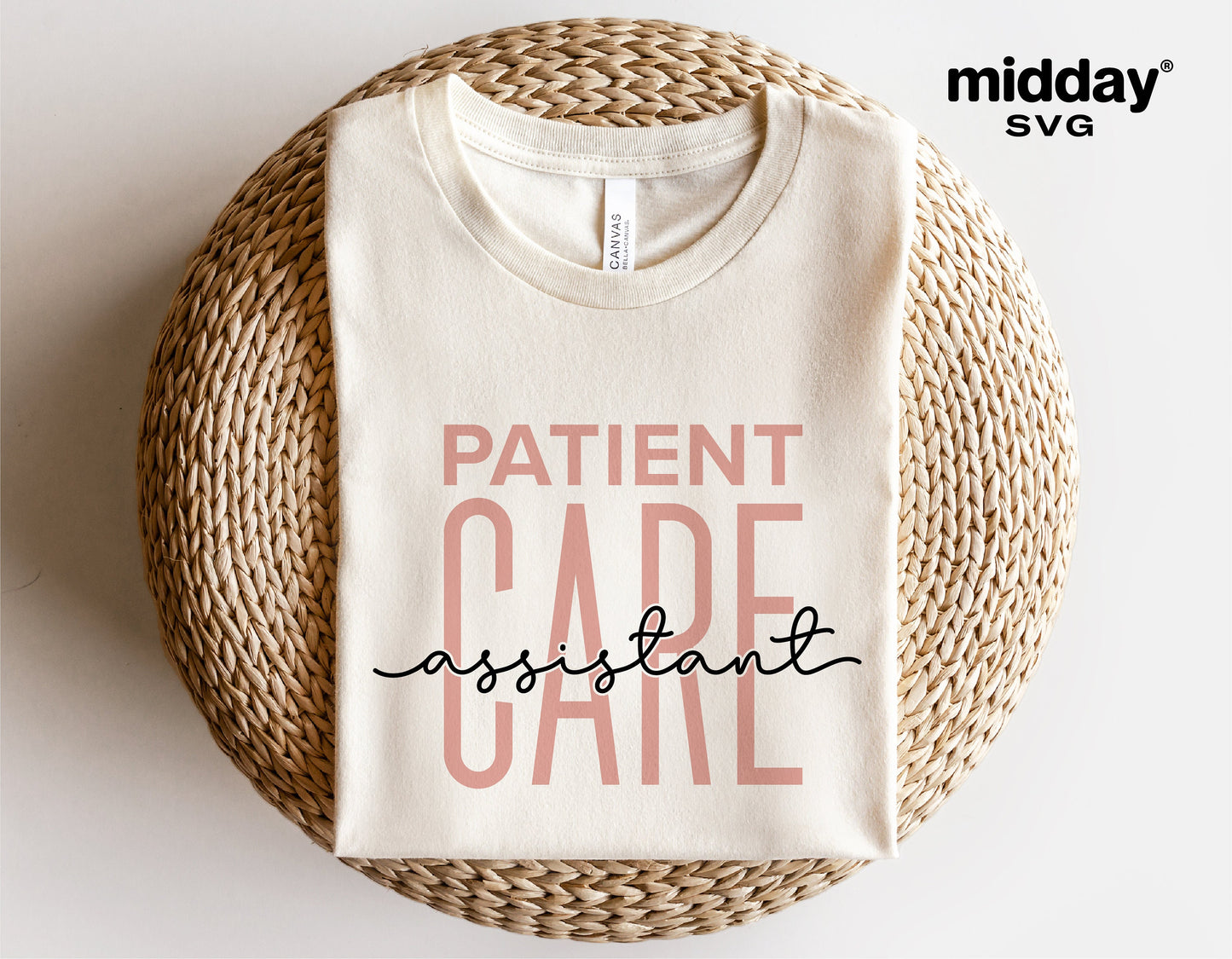 Patient Care Assistant shirt with text design, ideal for Cricut and silhouette cutting, displayed flat on a wicker chair.