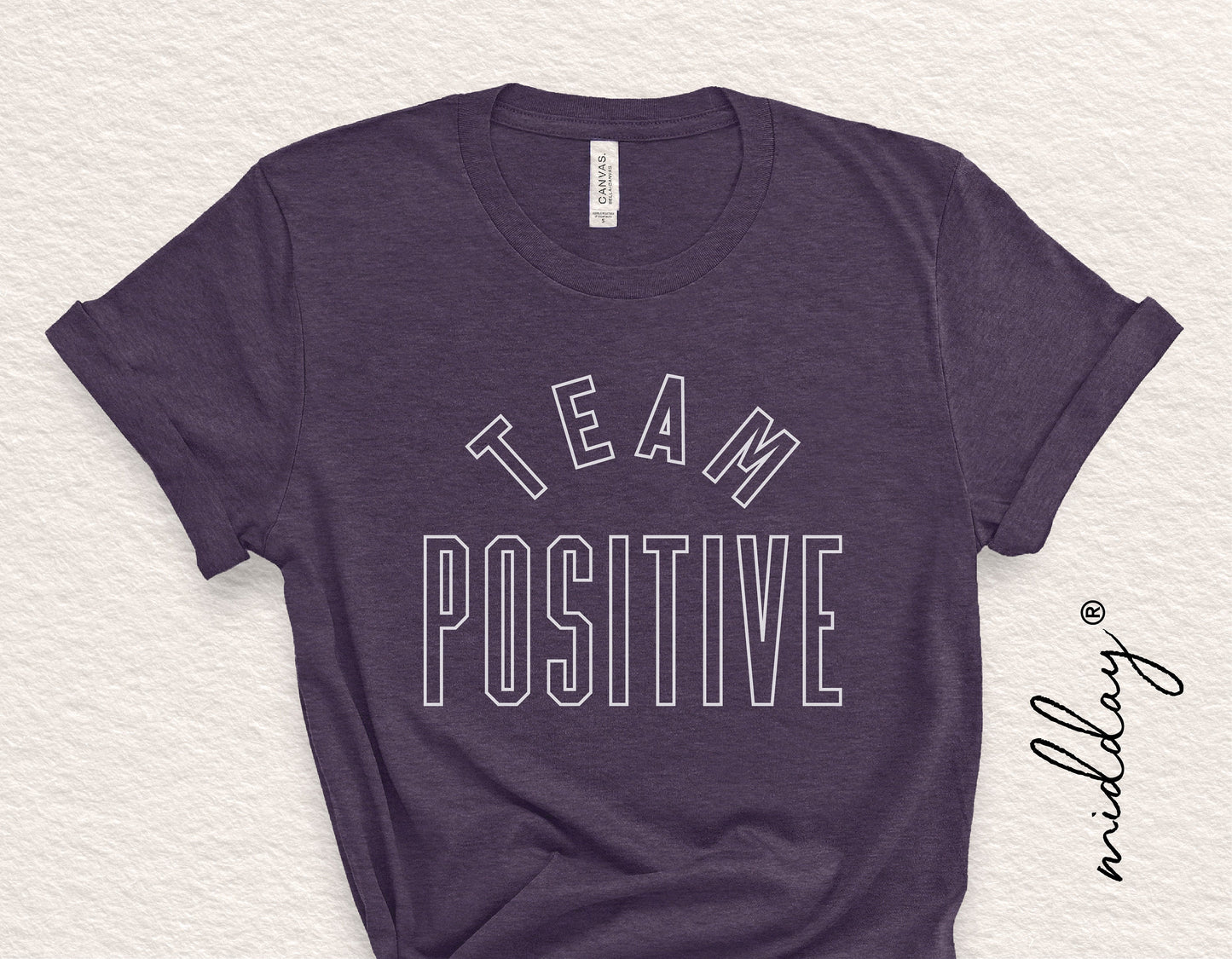 Dark t-shirt with 'Team Positive' text for inspirational and motivational purposes, suitable for Cricut and Silhouette design projects.