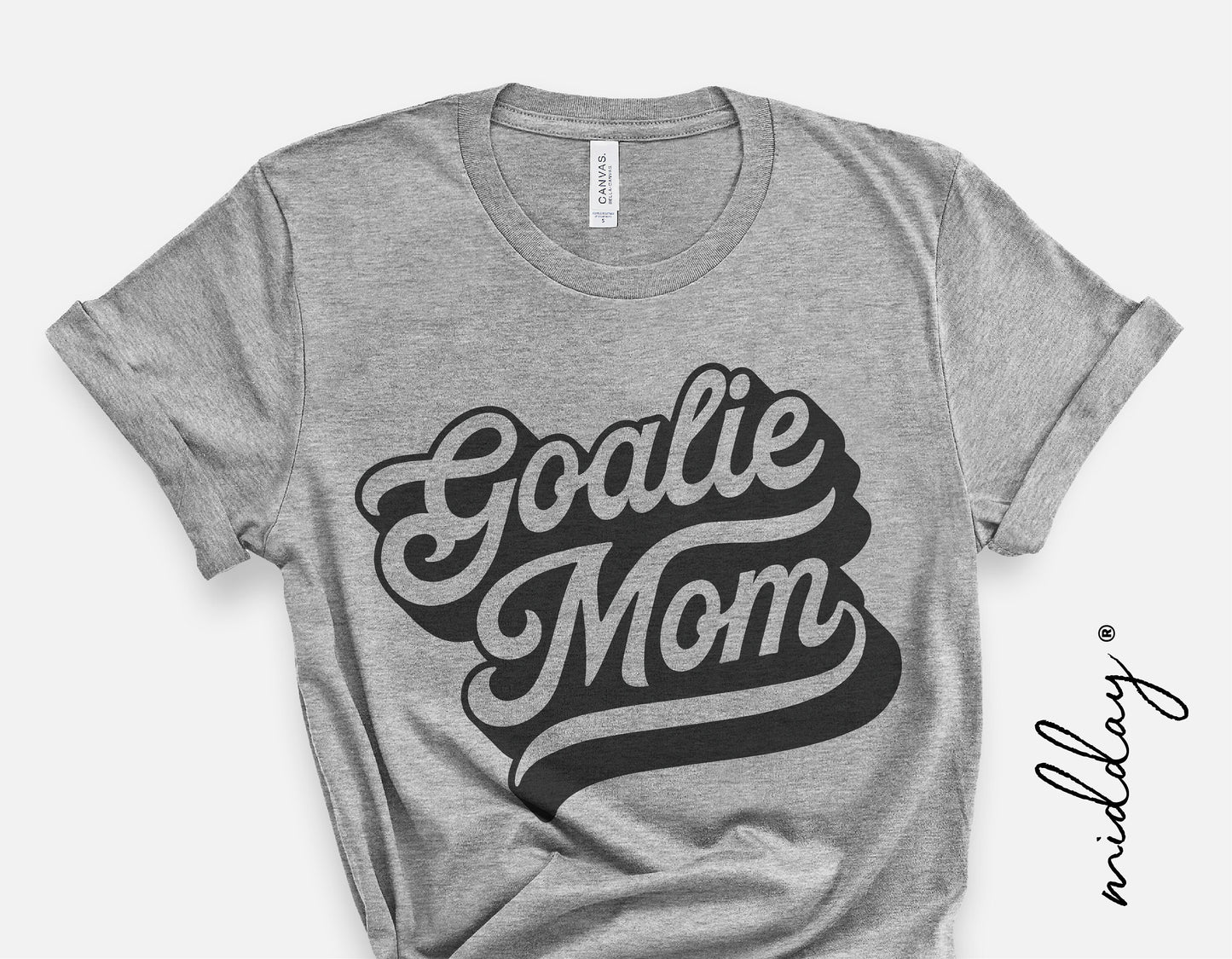 Gray t-shirt with 'Goalie Mom' design in bold black script, ideal for soccer moms, compatible with Cricut and Silhouette for custom prints.
