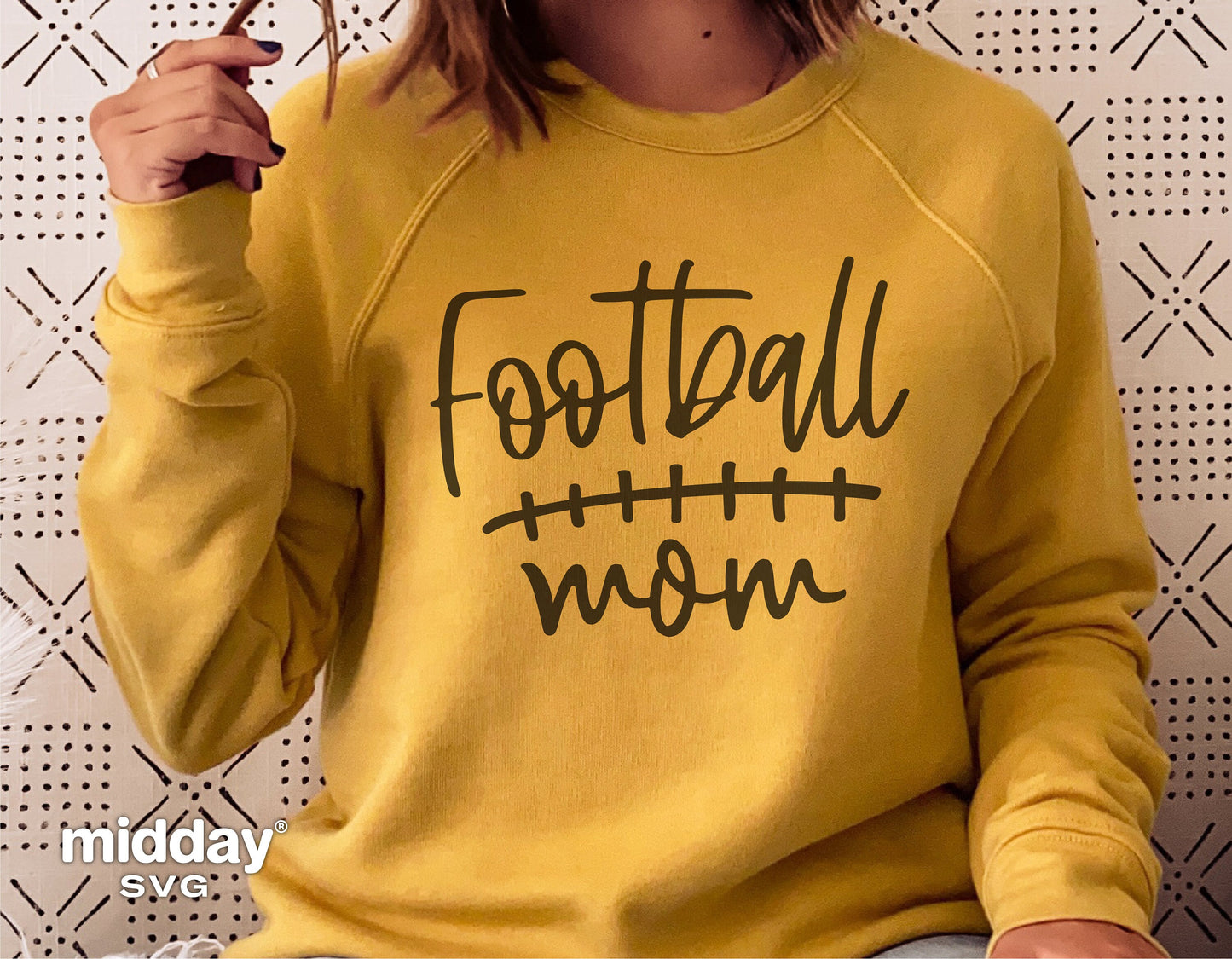 Yellow sweatshirt with 'Football Mom' design in black, suitable for Cricut and Silhouette cutting, perfect for team support apparel.