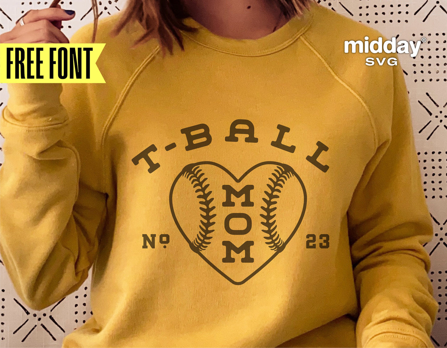 Yellow sweatshirt featuring 'T-Ball Mom' design with heart-shaped baseball graphic, ideal for Cricut and Silhouette projects.