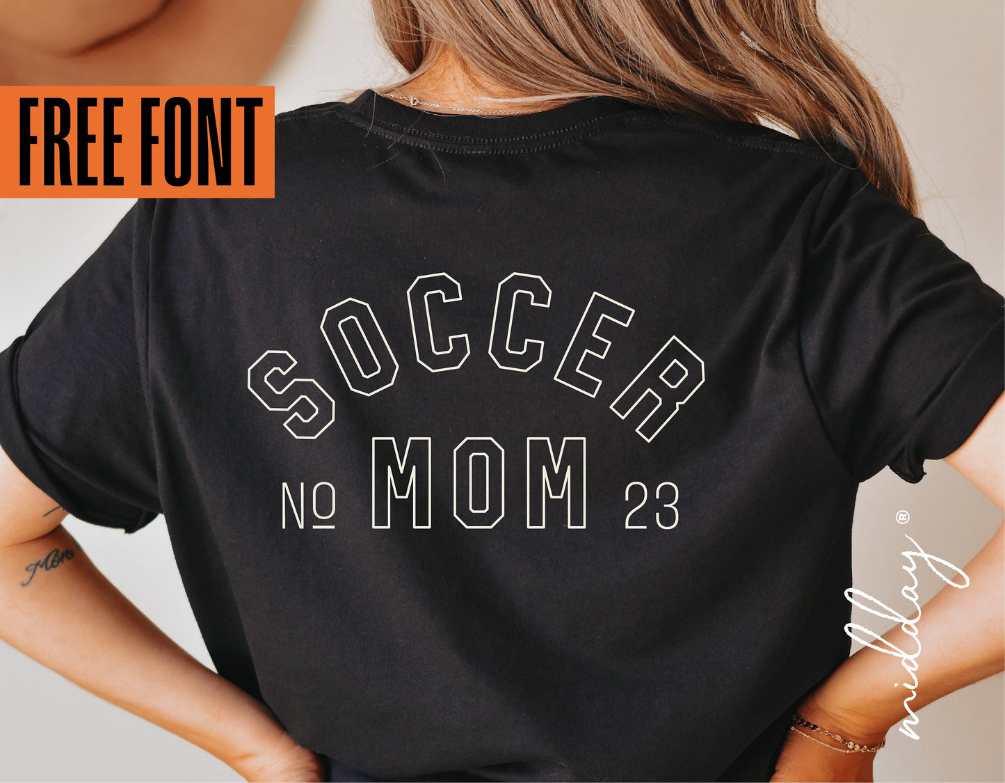 Rear view of a person wearing a black Soccer Mom t-shirt with bold font and No. 23 design, promoting a free font offer.