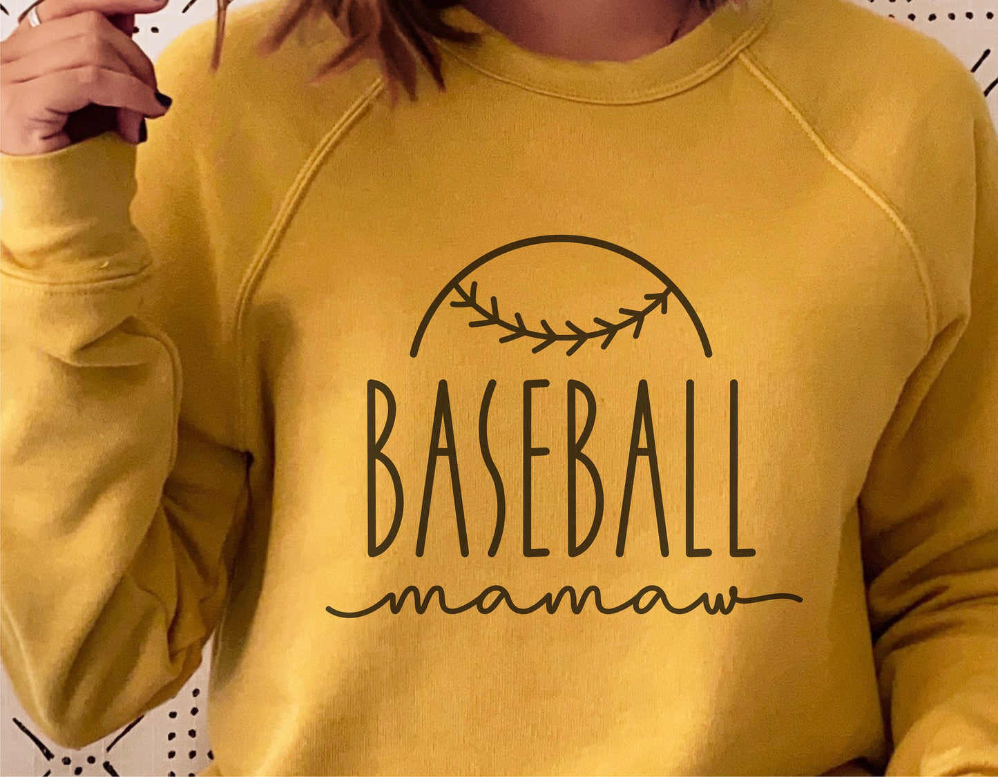 Yellow sweatshirt with 'Baseball Mamaw' design, featuring a baseball graphic, perfect for Cricut cut files and sublimation projects.