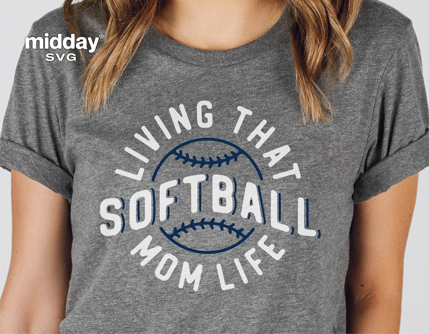 Gray t-shirt with 'Living That Softball Mom Life' text and a softball graphic, perfect for moms and sports enthusiasts.