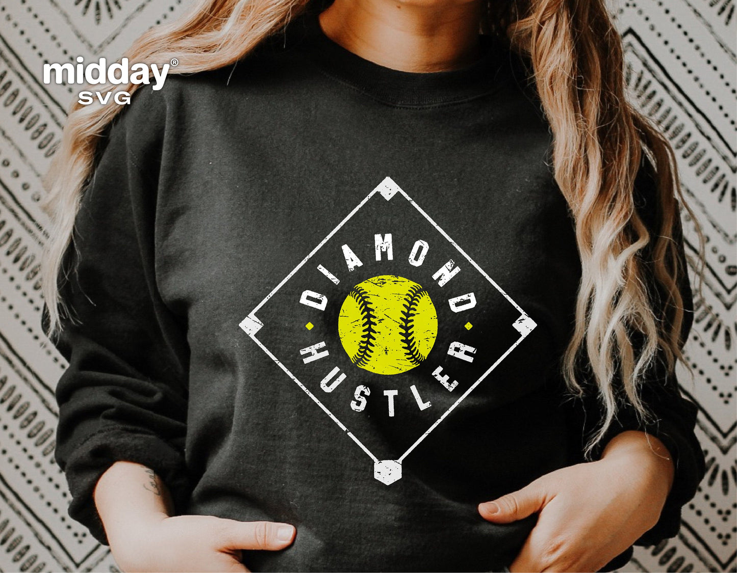 Person wearing black sweatshirt with 'Diamond Hustler' softball design, ideal for Cricut SVG and sublimation projects.