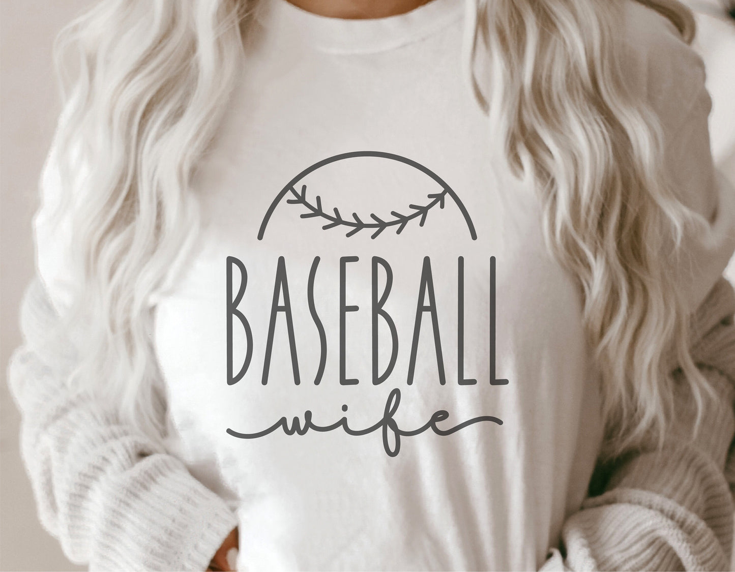 Woman wearing a 'Baseball Wife' shirt with baseball graphic, ideal for Cricut and Silhouette projects. Available in SVG and PNG formats.