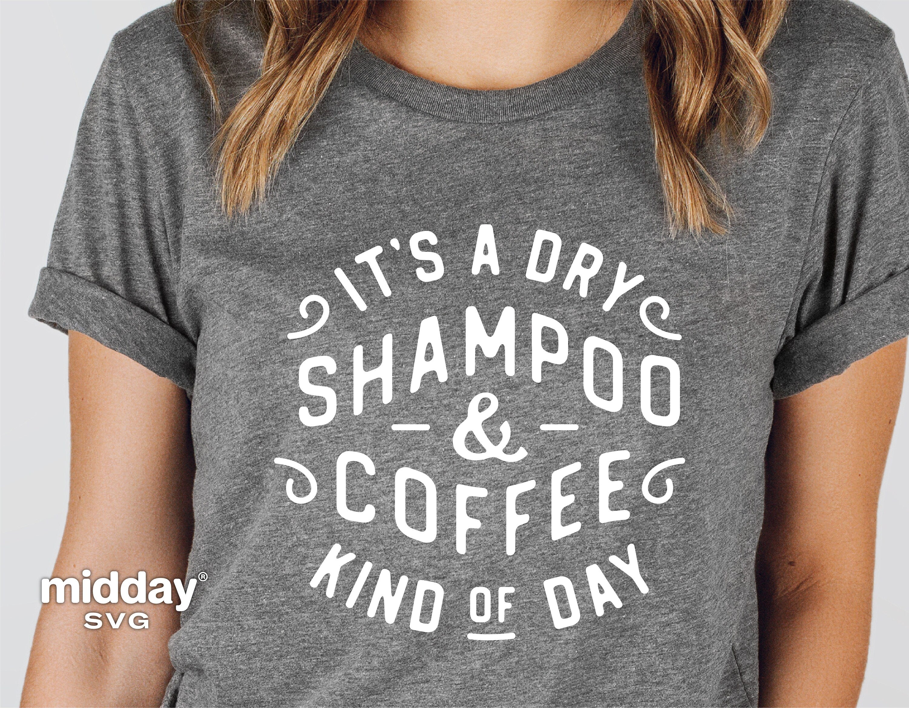 Woman wearing gray t-shirt with "It's a Dry Shampoo & Coffee Kind of Day" quote, perfect for Cricut and Silhouette projects.