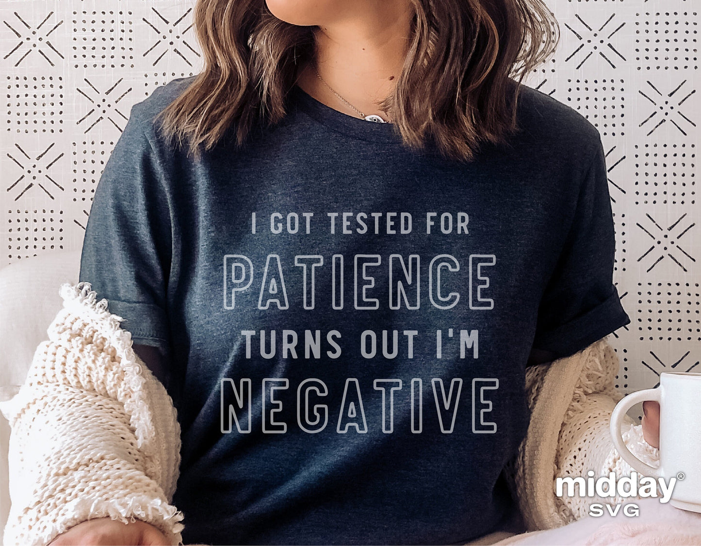 Woman wearing a t-shirt with text 'I got tested for patience, turns out I'm negative,' holding a mug, sarcastic funny design.