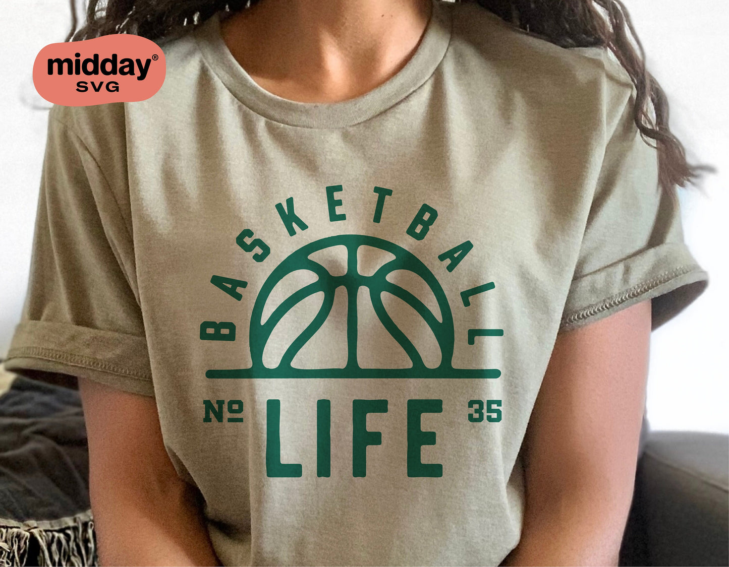 Woman wearing a shirt with 'Basketball Life' design featuring a sun-like basketball graphic, ideal for basketball fans using Cricut cut files.