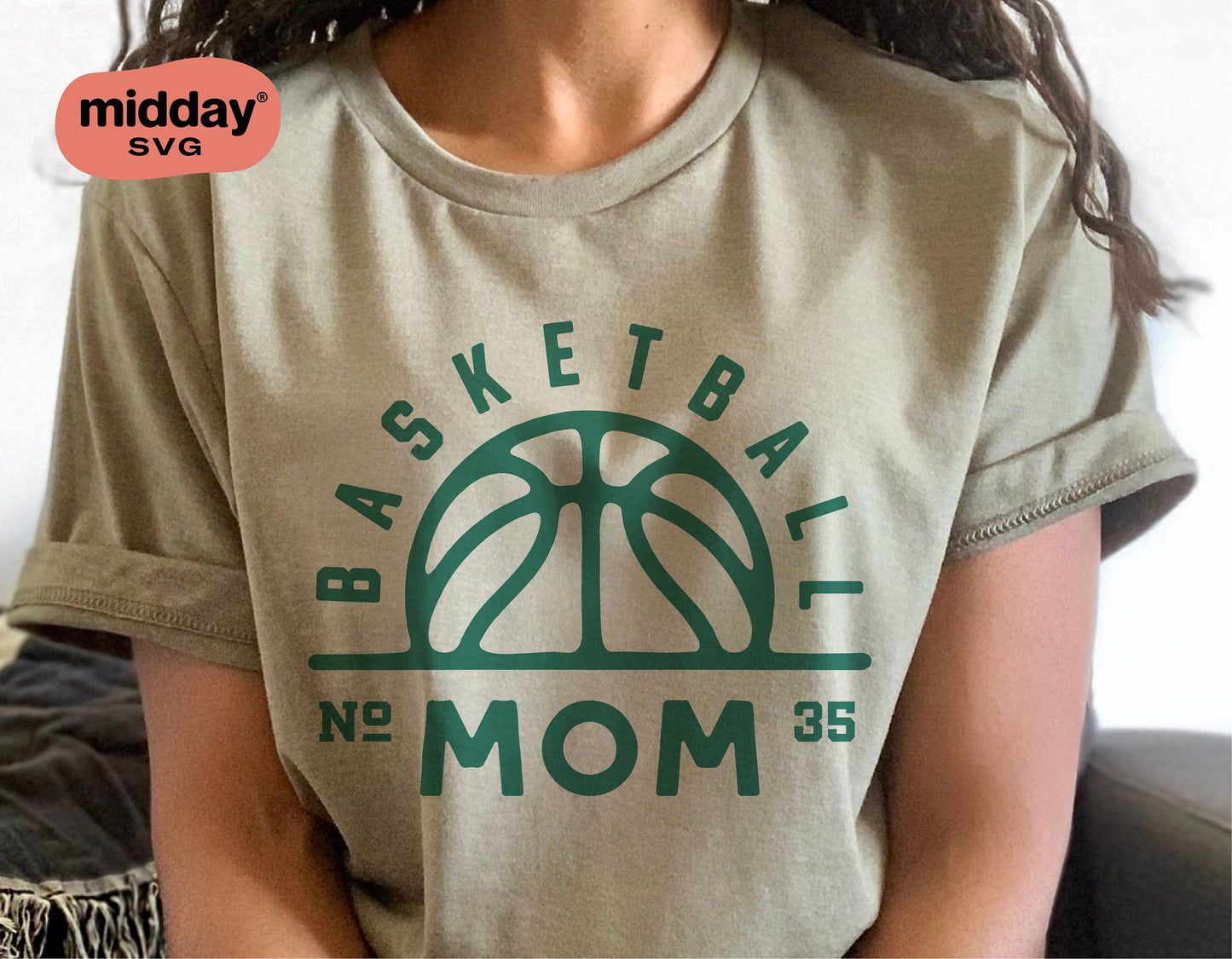 Woman wearing shirt with basketball mom SVG logo, suitable for Cricut and Silhouette crafts.