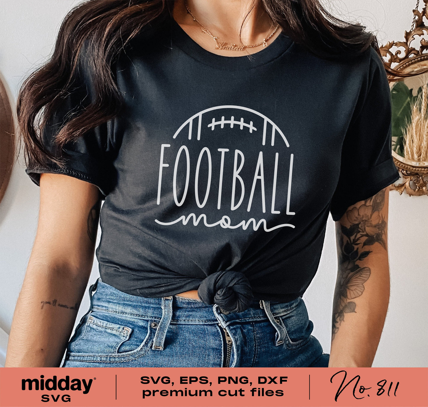 Woman wearing a black t-shirt with 'Football Mom' design, suitable for use with Cricut and Silhouette in SVG, EPS, PNG, DXF formats.
