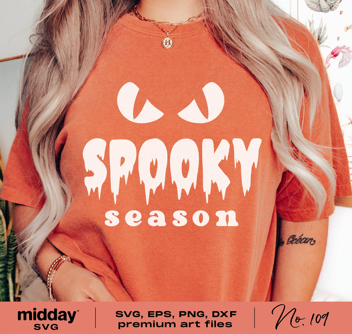 Person wearing a t-shirt with 'Spooky Season' in playful Halloween font, surrounded by plants, showcasing SVG design file for crafts.