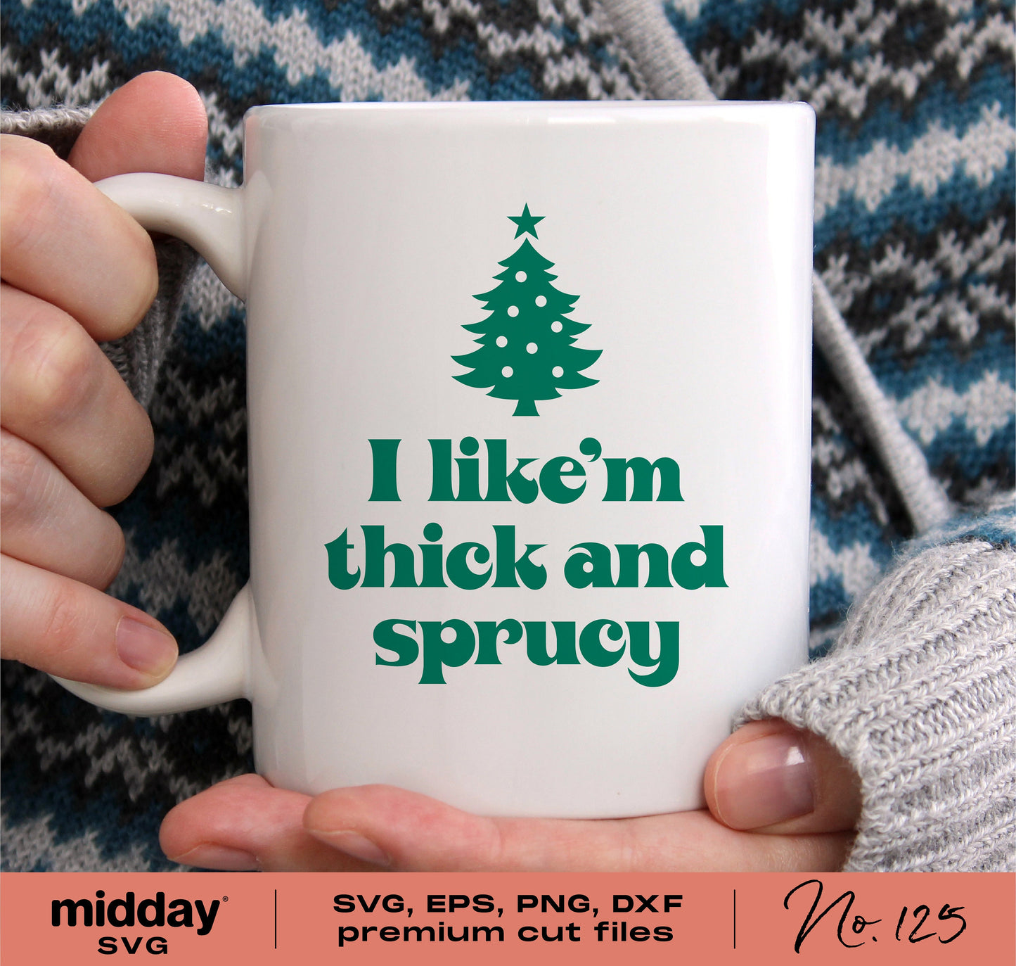 White mug with green Christmas tree design and text 'I like 'em thick and sprucy' held by person in sweater.