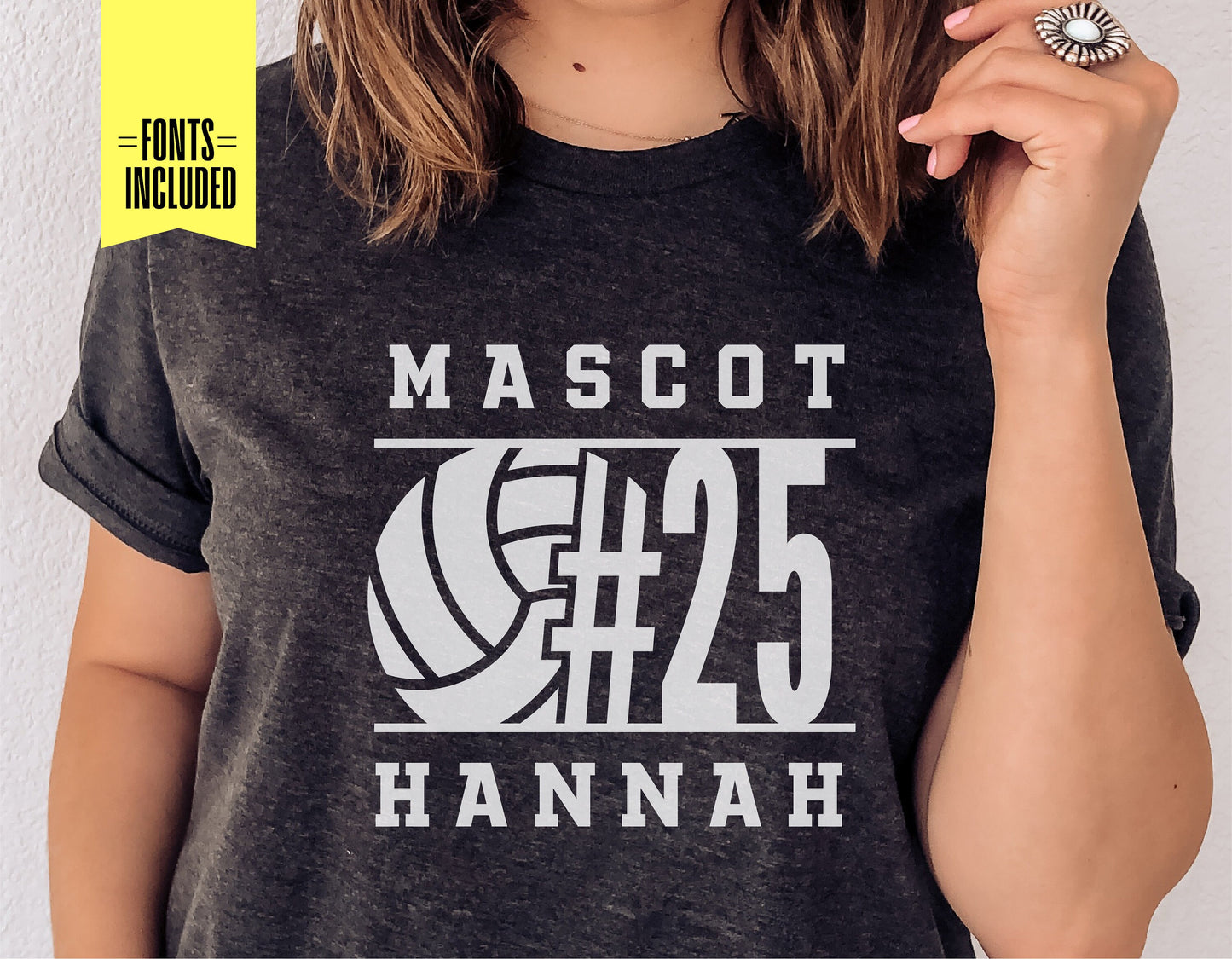 Woman wearing a personalized volleyball t-shirt with mascot, volleyball graphic, and number 25, showcasing custom fonts included.