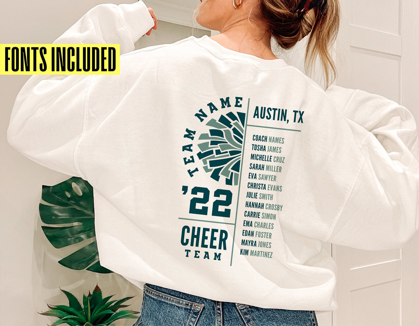 Person wearing a white sweatshirt with a custom cheer team print, including team name, location, and roster, perfect for cheerleading events.