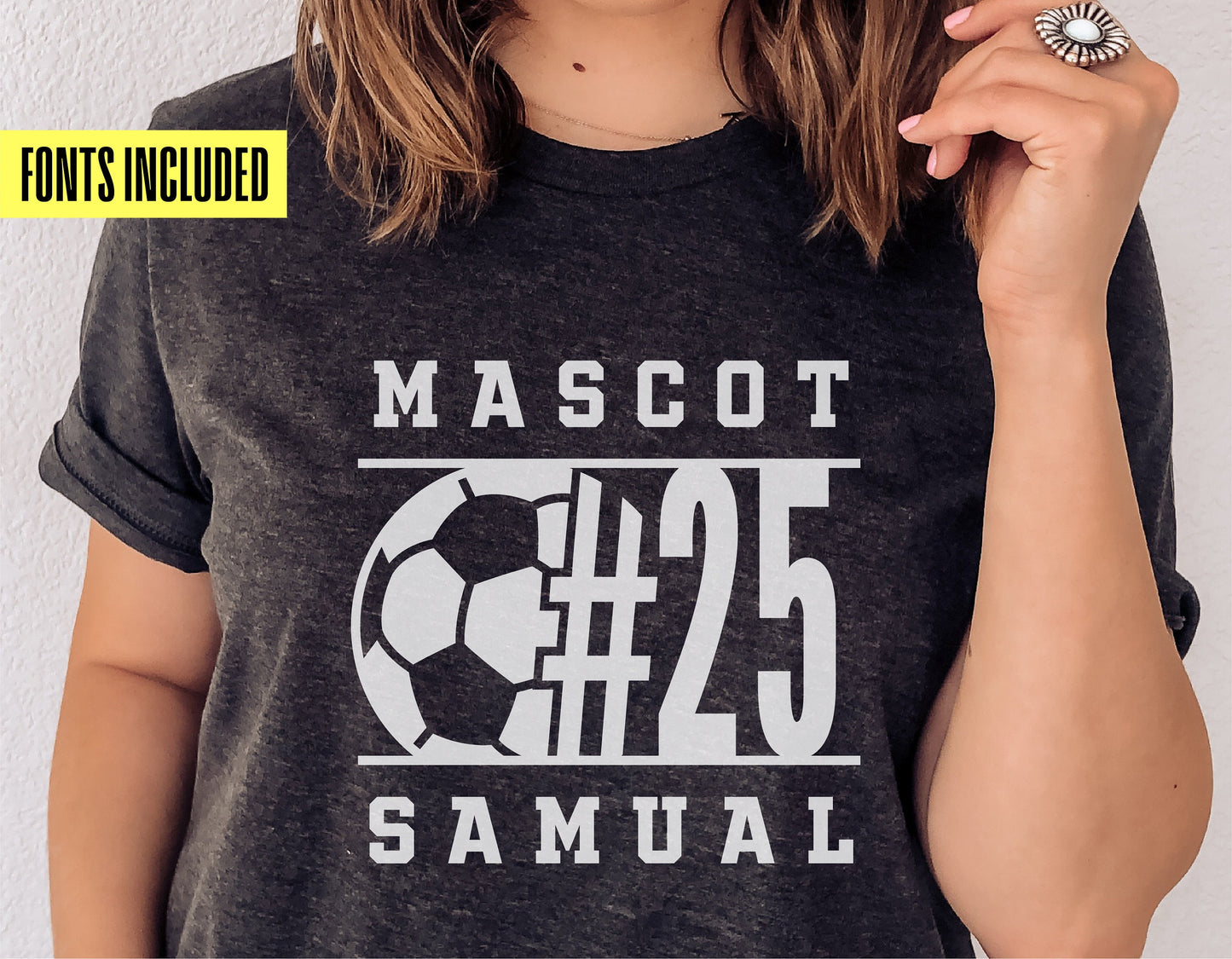 Person wearing a personalized soccer t-shirt with mascot design and number 25 in bold white letters, ideal for soccer enthusiasts.