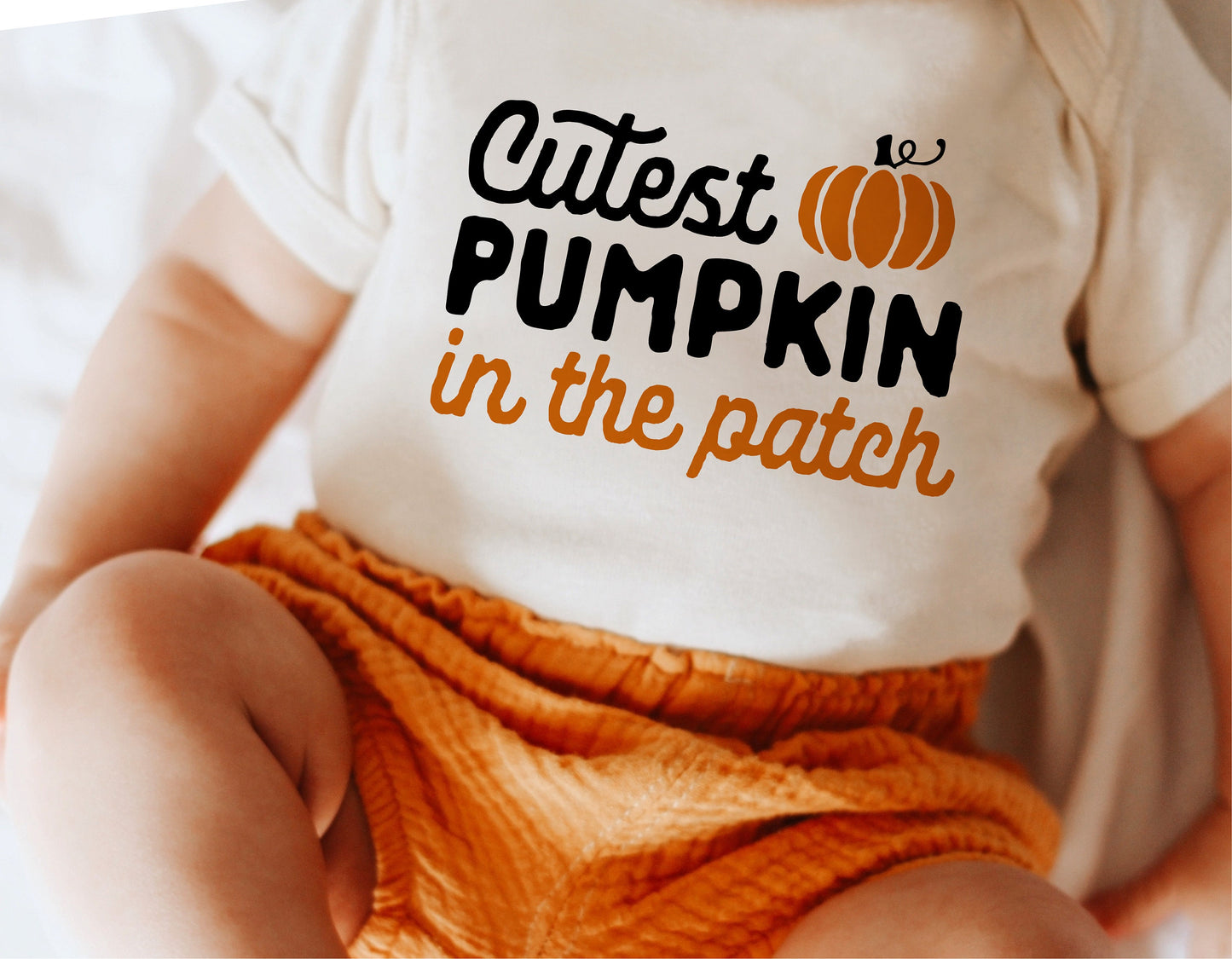 Baby wearing 'Cutest Pumpkin in the Patch' onesie, perfect for first Halloween, fall design for Cricut and Silhouette cut files.