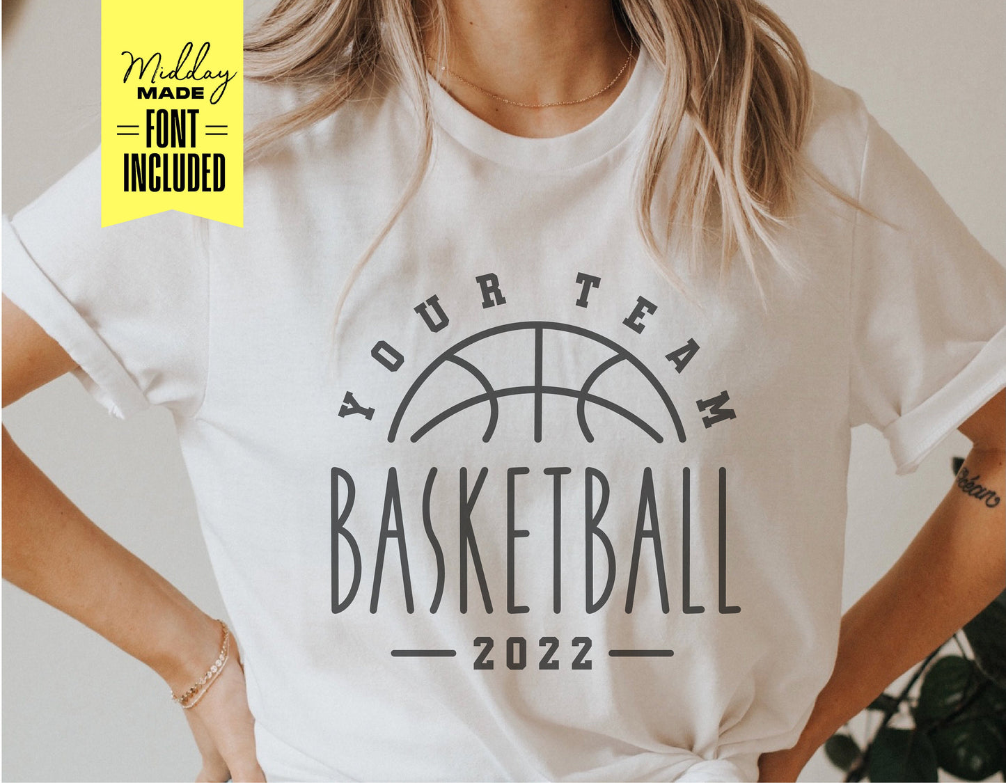 Person wearing a custom basketball team t-shirt with a hoop design and text "Your Team Basketball 2022" in stylish font.