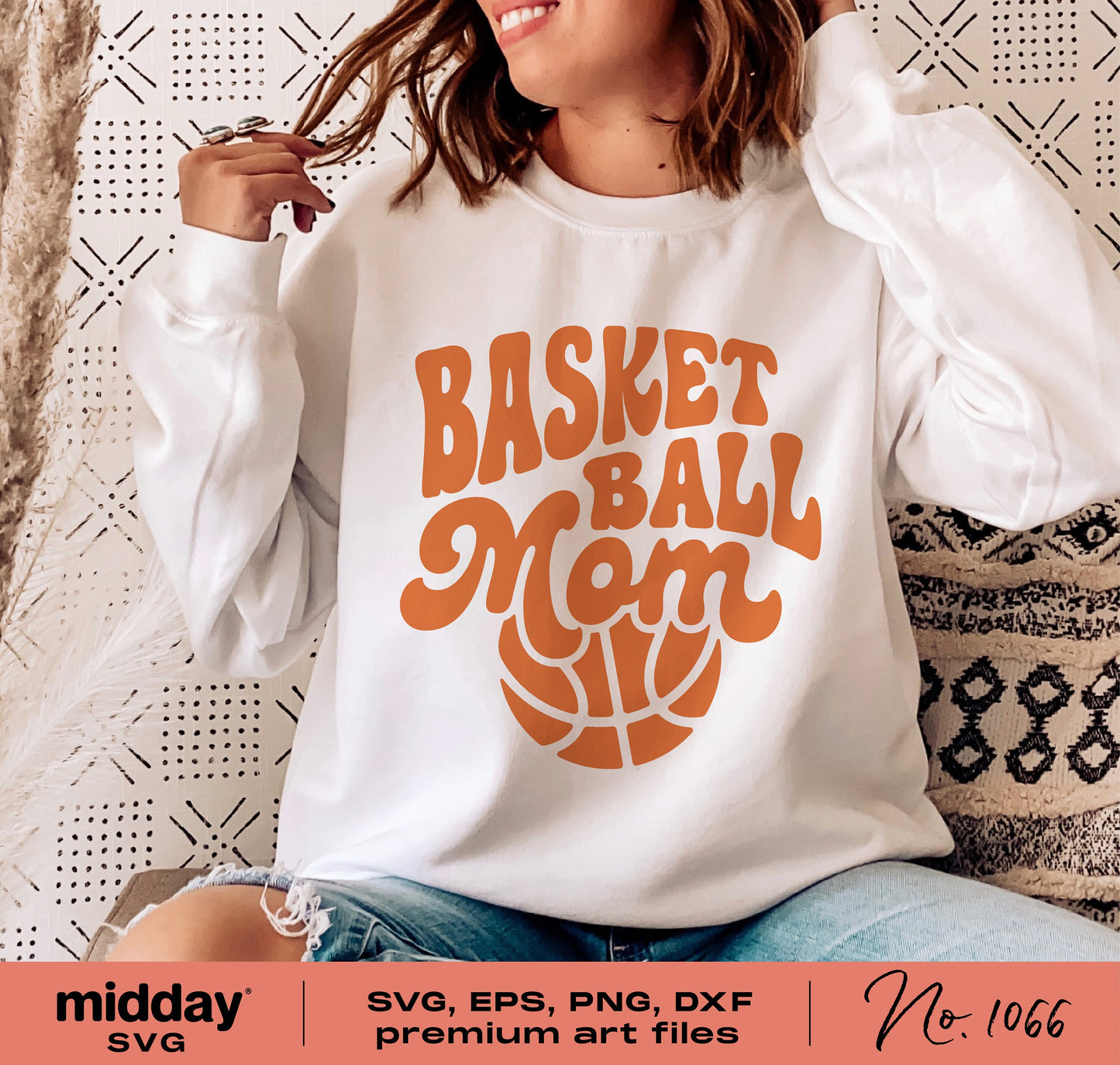 Woman wearing a white sweater with 'Basketball Mom' design in orange, suitable for Cricut and Silhouette, perfect for mom-themed apparel.