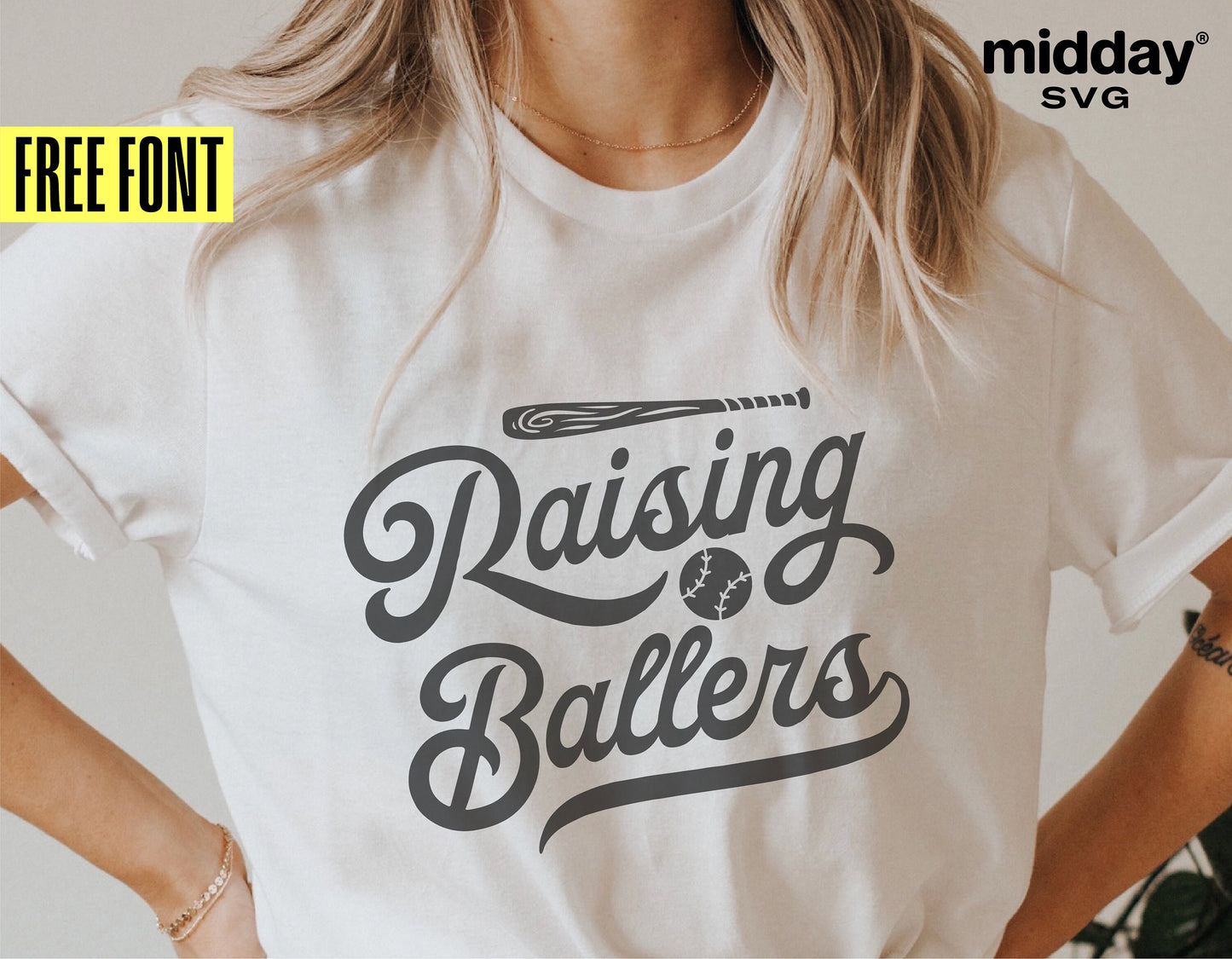 Person wearing 'Raising Ballers' baseball-themed t-shirt by Midday SVG, featuring script font and a baseball graphic.