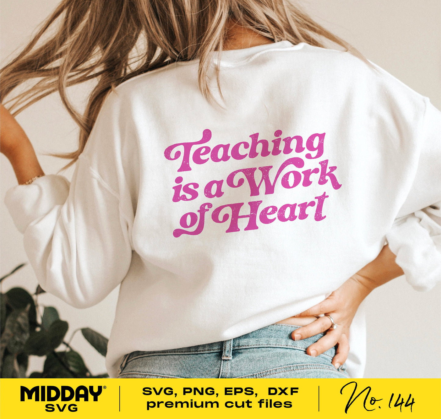Woman in white shirt with 'Teaching is a Work of Heart' printed in pink, ideal for teacher-themed Cricut and Silhouette projects.