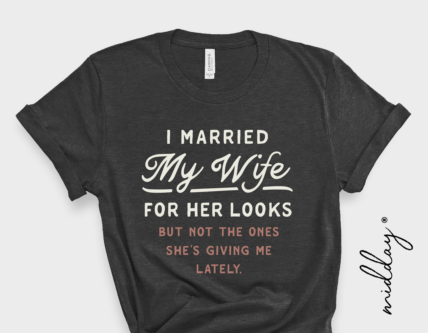 Black t-shirt with sarcastic text 'I Married My Wife for Her Looks, but Not the Ones She's Giving Me Lately'