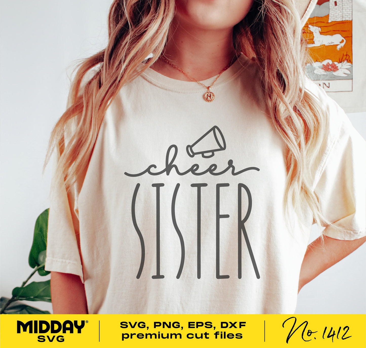 Woman wearing a shirt with 'Cheer Sister' design featuring a megaphone, suitable for Cricut and sublimation projects.
