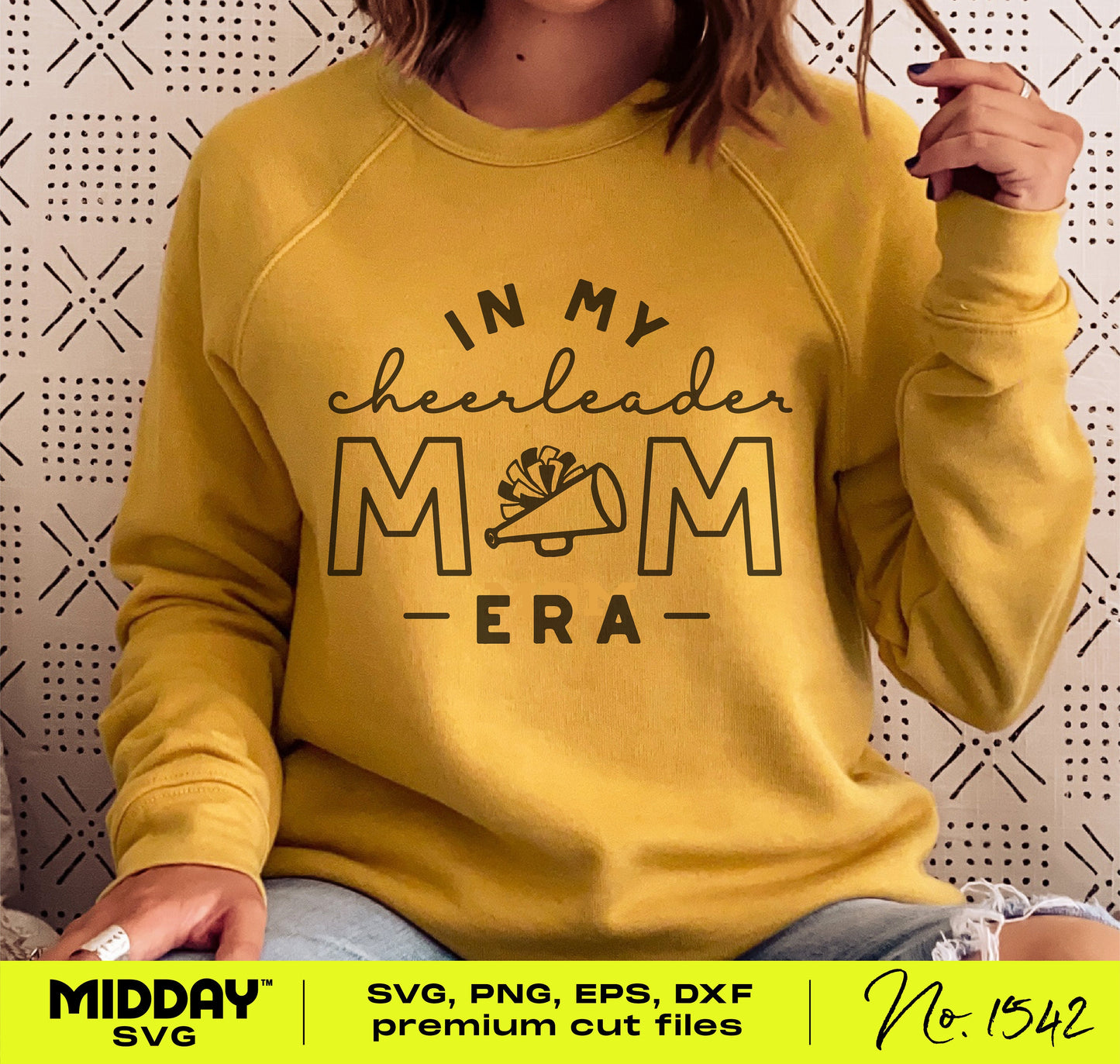 Woman wearing a yellow sweater with 'In My Cheerleader Mom Era' design, ideal for Cricut enthusiasts. Available in SVG, PNG, EPS, DXF formats. No. 1542.
