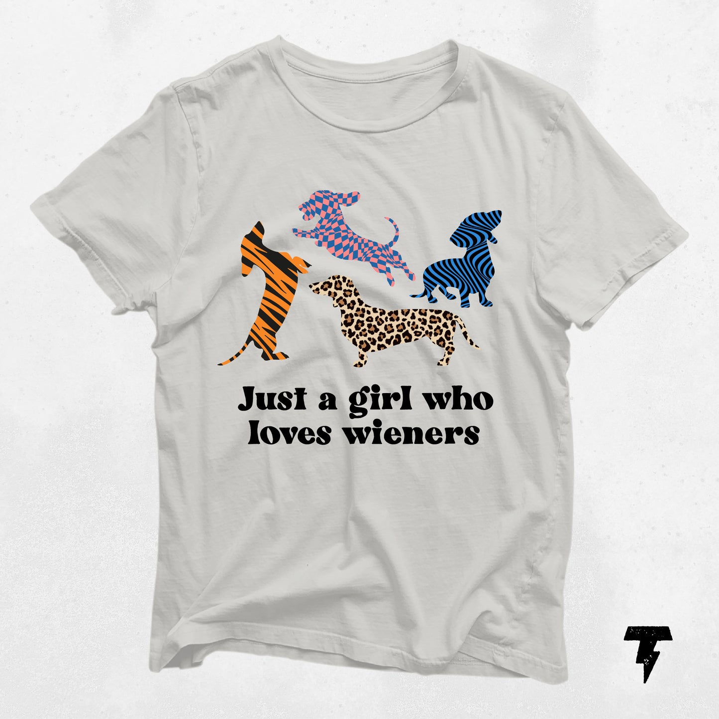 Dachshund shirt with colorful dog patterns and 'Just a girl who loves wieners' text.