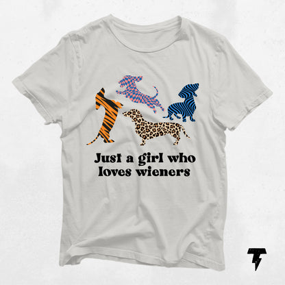 Dachshund shirt with colorful dog patterns and 'Just a girl who loves wieners' text.