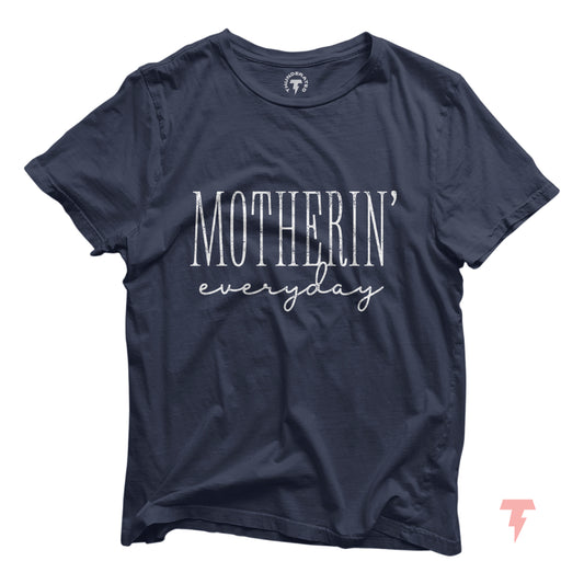 Navy blue funny mom shirt with 'Motherin' Everyday' slogan, perfect for casual wear or a baby shower gift, made of 100% cotton.