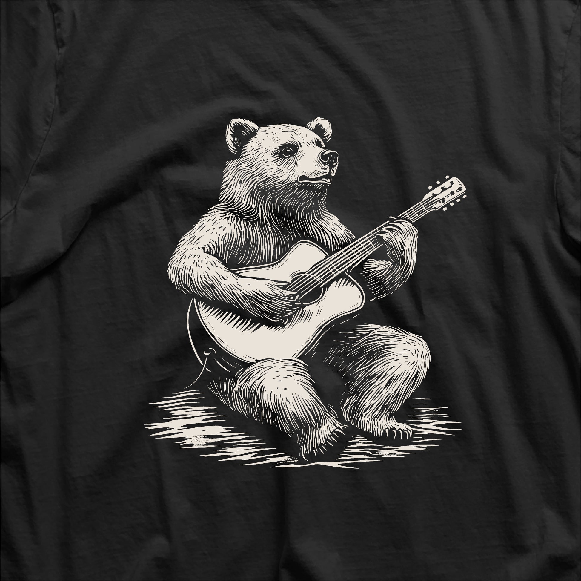 Graphic of a bear playing guitar printed on a musician-themed t-shirt, perfect gift for guitarists and music lovers.