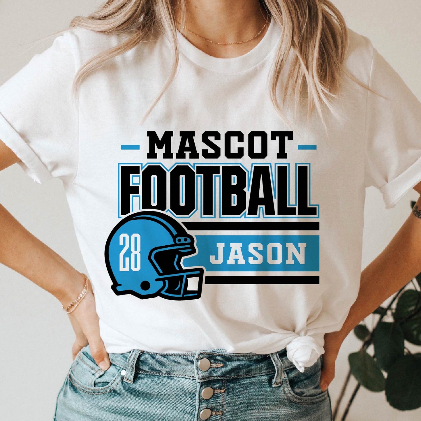 Person wearing a customized football team t-shirt with mascot helmet, player name, 'Jason', and number '28' in blue and black design.