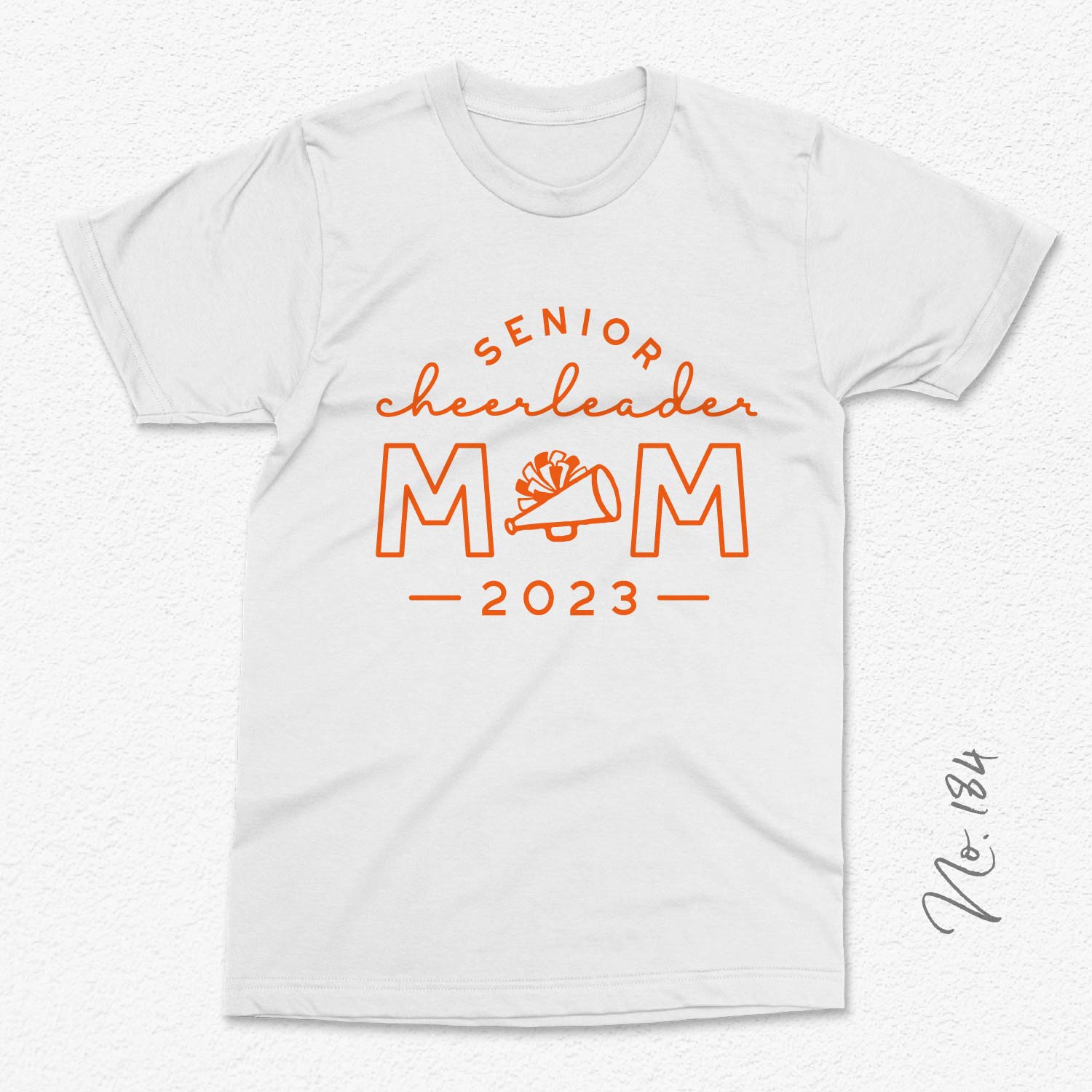 White t-shirt with 'Senior Cheerleader Mom 2023' design featuring an orange megaphone graphic.