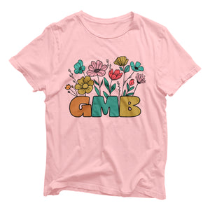 a pink t - shirt with the word gmb surrounded by flowers