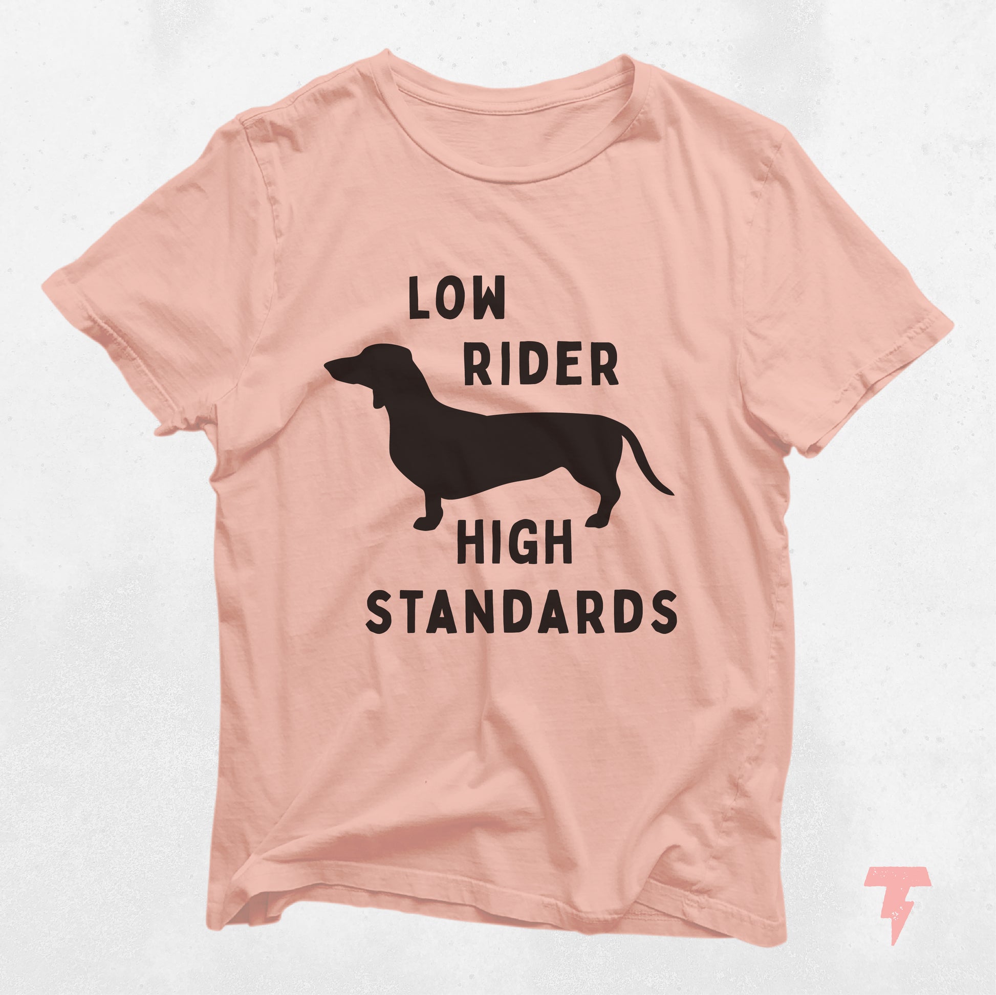 Pink dachshund shirt with 'Low Rider High Standards' text and silhouette design, perfect for dog moms and doxie lovers.