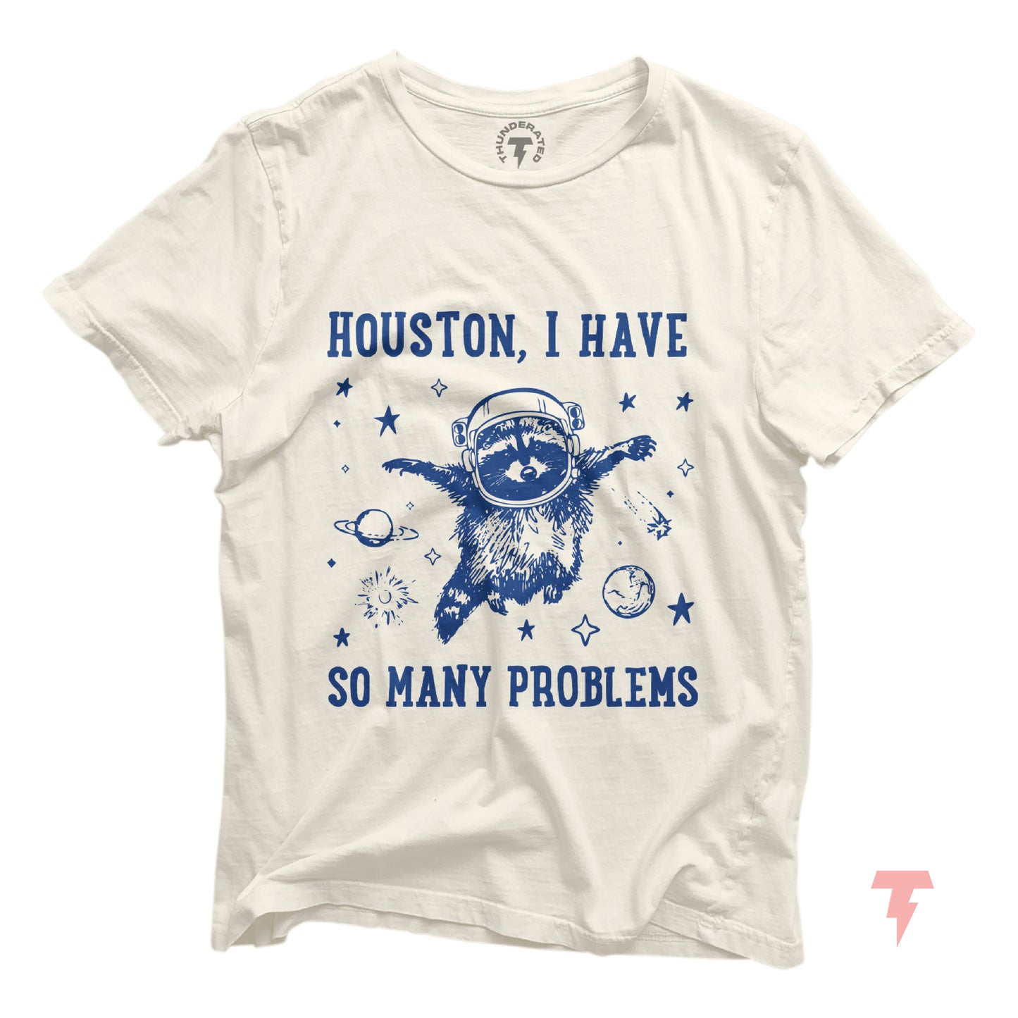 White t-shirt with 'Houston, I Have So Many Problems' and a distressed raccoon astronaut, floating in space, surrounded by stars and planets.