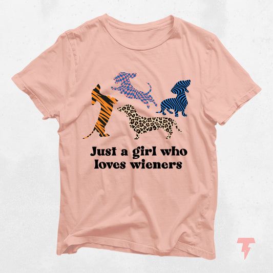 Pink dachshund t-shirt with colorful patterns and "Just a girl who loves wieners" text. Perfect gift for dog moms and dachshund lovers.