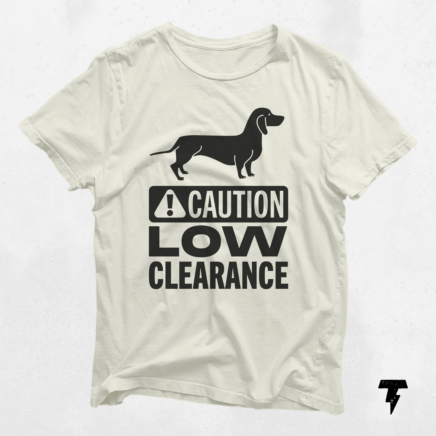 White dachshund shirt with 'Caution Low Clearance' print, cute gift for dog moms, unisex and made from soft cotton.